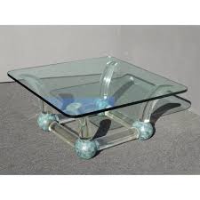 Tubular lucite pillars hold 3/4 blue tinted glass. Vintage Mid Century Modern Lucite Sabre Legs Coffee Table Turquoise Petina Ball Feet Chairish