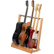I like having my guitars out so i can just grab one and play, but having 5 guitars and stands cluttering the bedroom, which is the only place i can thus, the solution was to put them in a guitar rack. Amazon Com String Swing Guitar Stand For 6 Electric Or Bass Or 3 Acoustic Guitars For Home Or Studio Cc34 Musical Instruments