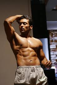 Vijay can be seen in a rugged look holding a gun. Actor Suriya Hot Six Pack Photos Sexy Abs Showing Pictures Chandrakanth