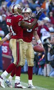 San Francisco 49ers Quarterback Jeff Garcia Is Greeted By Teammate Terrell Owens After Running In A Touchdown Agai 49ers San Francisco 49ers Nfl 49ers Players