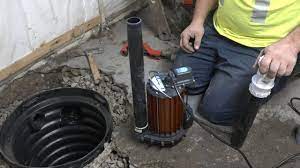 Place the sump basin in the hole. Installing A Sump Pump Youtube