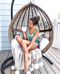 Belham Living Tanna Tear Drop Resin Wicker Hanging Egg Chair With Cushion And Stand Hayneedl Hanging Egg Chair Hanging Chair With Stand Hanging Chair Outdoor