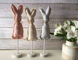 If you like a rustic look in home decorations, these farmhouse easter decor items might interest to give your home the look of farmhouse decorating means to use items that are warm, cozy and relaxing. Farmhouse Bunnies Rustic Fabric Bunny Easter Table Decor Etsy Primitive Easter Decor Rustic Easter Decor Easter Table Decorations