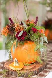 Assemble the centerpieces a couple of days beforehand so you can have perfectly blooming flowers at the wedding by adding warm water (only enough to cover roots, not bulb) to get the petals to open, or cold water to keep them from opening too fast. Fall Wedding Flowers With Orange Details Modwedding