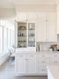 White Kitchen Glass Cabinet Brass Hardware Shelf Decor With Pretty Kitchen Details Kitchendesign Kitchen Kitchen Renovation Kitchen Remodel Home Kitchens