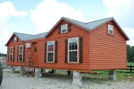 If you're looking for a camping getaway the artfully crafted log cabins are gorgeous to behold and even have porches and a porch swing to enjoy in warmer weather. 7 Beautiful Modular Log Cabins From Amish Cabin Company Tiny Houses