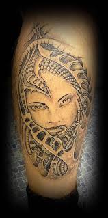 The many types of tattoo designs depicting wolves include the tribal wolf design, the native american depiction of the wolf, the skull and wolf motif, the icy looking wolf with blue eyes, the celtic version of the wolf. Grey Ink Biomechanical Woman Face Tattoo On Leg Truetattoos