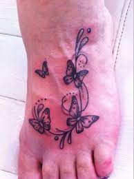 Butterfly Design On A Womans Foot Foot Tattoos Pink Tattoo Ink Ink Tattoo