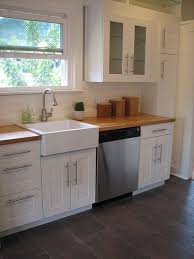 Modern Farmhouse Kitchen With Ikea Adel Cabinetry Butcherblock Counters And Domsjo Sink Ikea Kitchen Design Kitchen Remodel Modern Farmhouse Kitchens