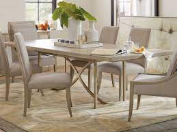 Serene dining room designed with ceramic plate decors mounted on the sky blue wall. Hooker Furniture Elixir Serene Gray Beige Champagne Silver 80 100 W X 42 D Rectangular Dining Table With Extension Hoo599075200ltwd
