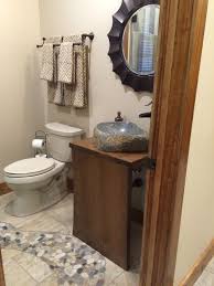 River rock flooring, carrera marble tile and a black slate bench! River Rock Mosaic Tile Inlay Bath Floor Leads To Shower Eklektisch Badezimmer New York Von Tayrose Design