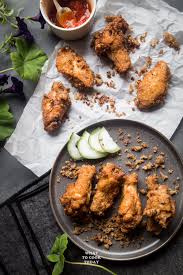 In terms of the cooking process, porridge is cooked using rice grains simmered in water or stock; Ultra Crispy Shrimp Paste Chicken Har Cheong Gai