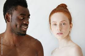Portrait of happy loving interracial couple: shirtless African man looking  at his nude redhead Caucasian girlfriend