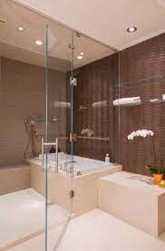 When a bathroom wall features peach and brown tiles, wall color options depend on the shade and undertone, or underlying hue, of the brown tile. 23 Brown Tile Design Ideas For Your Kitchen Bath Sebring Design Build