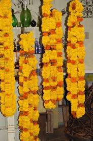 Marigold Garlands Hand In The Shop Waiting To Be Delivered For An Indian Wedding Ceremony At The Ro Marigold Wedding Indian Wedding Ceremony Floral Accessories