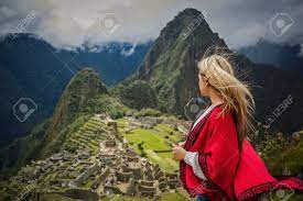 Woman In Red Dress On Vacation In Machu Picchu Cusco Peru Stock Photo,  Picture And Royalty Free Image. Image 135095389.