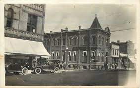 Adrian Ia Department Store Corner Bank W Turret Gone Clothier 1920s Cars Rppc Postcard Scenes Street View