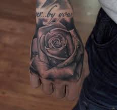 This is the perfect rose tattoo for any man who wants to leave everyone in awe when they remove their shirts. Rose Tattoos Are Always In Bloom Rose Tattoos For Men Hand Tattoos For Guys Rose Hand Tattoo