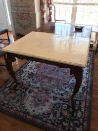I used a very rough grit sandpaper (80) with a medium to light touch, and went to work sanding off the white chalk paint layer on the parts of the table i thought would wear naturally with age (like the corners of the legs and top). Painting A Dining Room Set With Chalk Paint The Purple Painted Lady