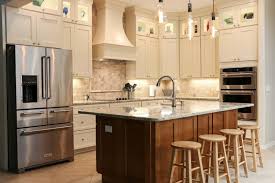 The narrow marble kitchen island with black legs also feels true to the home's architectural integrity. 5 Beautiful Yet Functional Kitchen Islands Cabinets Com