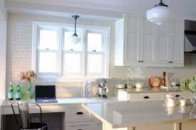 Nannette brown added american olean tiles to the ceiling, stove's backsplash, and a. Image Result For White Subway Tile Around Kitchen Window White Shaker Kitchen Home Kitchens White Granite Countertops
