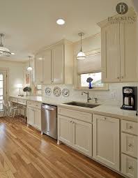 Traditional Kitchen Design By Blackline Renovations Quartz Countertops White Subway Tile Cre Beige Kitchen Beige Kitchen Cabinets Traditional Kitchen Design