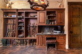 Modern interior design and decor of this new hunting lodge were created with urban luxury and elegance and give great inspirations for using rich dark room colors for your den, hunting cabin or cottage decorating. Rustic Modern Hunting Lodge Gun Room Laundry Room Rustikal Hauswirtschaftsraum Charlotte Von Greenbrook Design Center Houzz