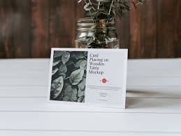 Download Free Greeting Card Mockup On A Wooden Table Free Mockup