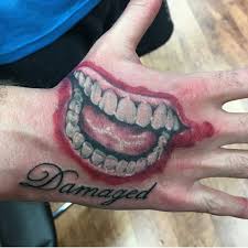 2 169 Likes 17 Comments The Clown Prince Of Crime Thejoker Official On Instagram Hand Piece From Bab Hand Tattoos Joker Smile Hand Tattoo Joker Tattoo