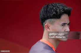 Referee Ahmed Eisa Darwish gives a yellow card to Ogura Kosei of... News  Photo