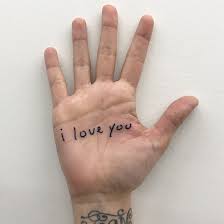 The Phrase I Love You Inked On The Right Hand S Palm Love Yourself Tattoo One Word Tattoos Word Tattoos