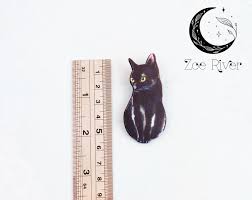 black cat brooch