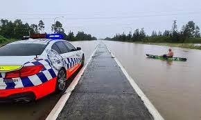 Australian Paddles A Kayak Down A Closed Pacific Highway In Nsw During Wild Weather Daily Mail Online