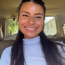 How deep should a raised garden bed be, ideally, for growing tomatoes?