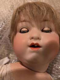 What to do with a vintage composite baby doll before rehoming it?