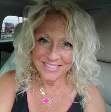 Free IKEA Karlstad 2 seater couch w teal cover. The cover is worn and has  some cat scratches