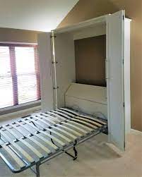 Maybe you would like to learn more about one of these? Murphy Bed With Bi Fold Doors With Storage Behind The Bed For Linens Brown Bed Linen Bed Linens Luxury Murphy Bed