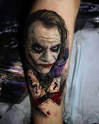 Heath joker portrait tattoo on sleeve. Smile Joker Sleeve Tattoo For Couples Cool Arm Forearm And Chest Designs