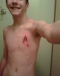 Keep it simple by placing them on either side of your upper torso, or create a galaxy across your chest. Smallest Star Trek Insignia Tattoo On Boy Chest