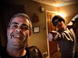 This is one of the last photos of me and my boy before he passed, is  possible to brighten it up a bit and make me look less drunk and make my