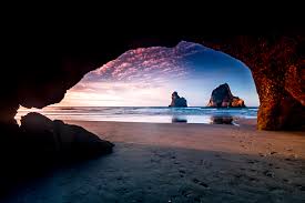 24/7 customer service · no booking fees · secure booking Sunset Wharariki Beach Cave Archway Islands South Island New Zealand