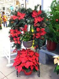 A Hanging Basket Stand With Holiday Flowers By Rambo Nursery Stand Available At Home Depot Poi Garden Center Displays Hanging Basket Stand Holiday Flower