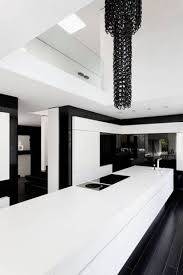 Above the island hangs a glass pendant light, and. Modern Kitchen Ideas Black And White Homyracks