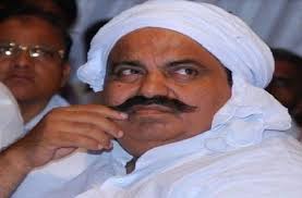 How fair is it to portray Atiq merely as a 'former MP'?