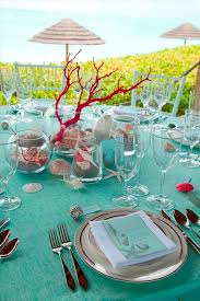 Embellished with a handmade shell necklace a simple glass candle. Sea Inspired Table Setting And Ideas For Your Beach Themed Party Beach Wedding Table Settings Romantic Beach Wedding Beach Themed Party