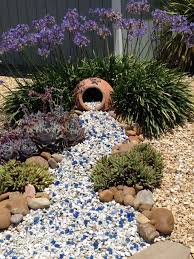 Three Years After First Posted Plants Have Grown And Blue Rock Added To White Gravel An Eye Catch Rock Garden Landscaping Rock Garden Landscaping With Rocks