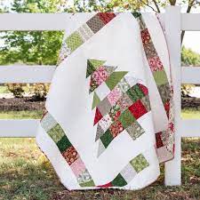 It has colored drawings that show each step. Shortcut Quilt Charming Christmas Free Charm Pack Pattern The Jolly Jabber Quilting Blog Christmas Tree Quilt Quilts Christmas Quilts