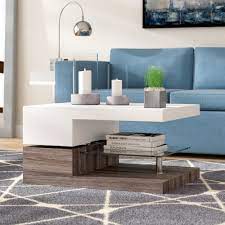 The colored glass sculptural base and brushed metal top, are fashioned into an elegant pairing with brushed antiqued gold and glass in a modern silhouette. Ivy Bronx Littlehampt Extendable Floor Shelf Single Coffee Table With Storage Reviews Wayfair
