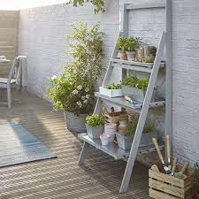 We found the best plant stands you can buy online. B Q S New Rural Outdoor Collection Includes This Contemporary 3 Tier Shelving Unit Garden Design Ideas On A Budget Small Garden Design Small Garden On A Budget