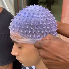 Brazilian hairstylist uses perforated caps to dye polka dots onto men’s  hair